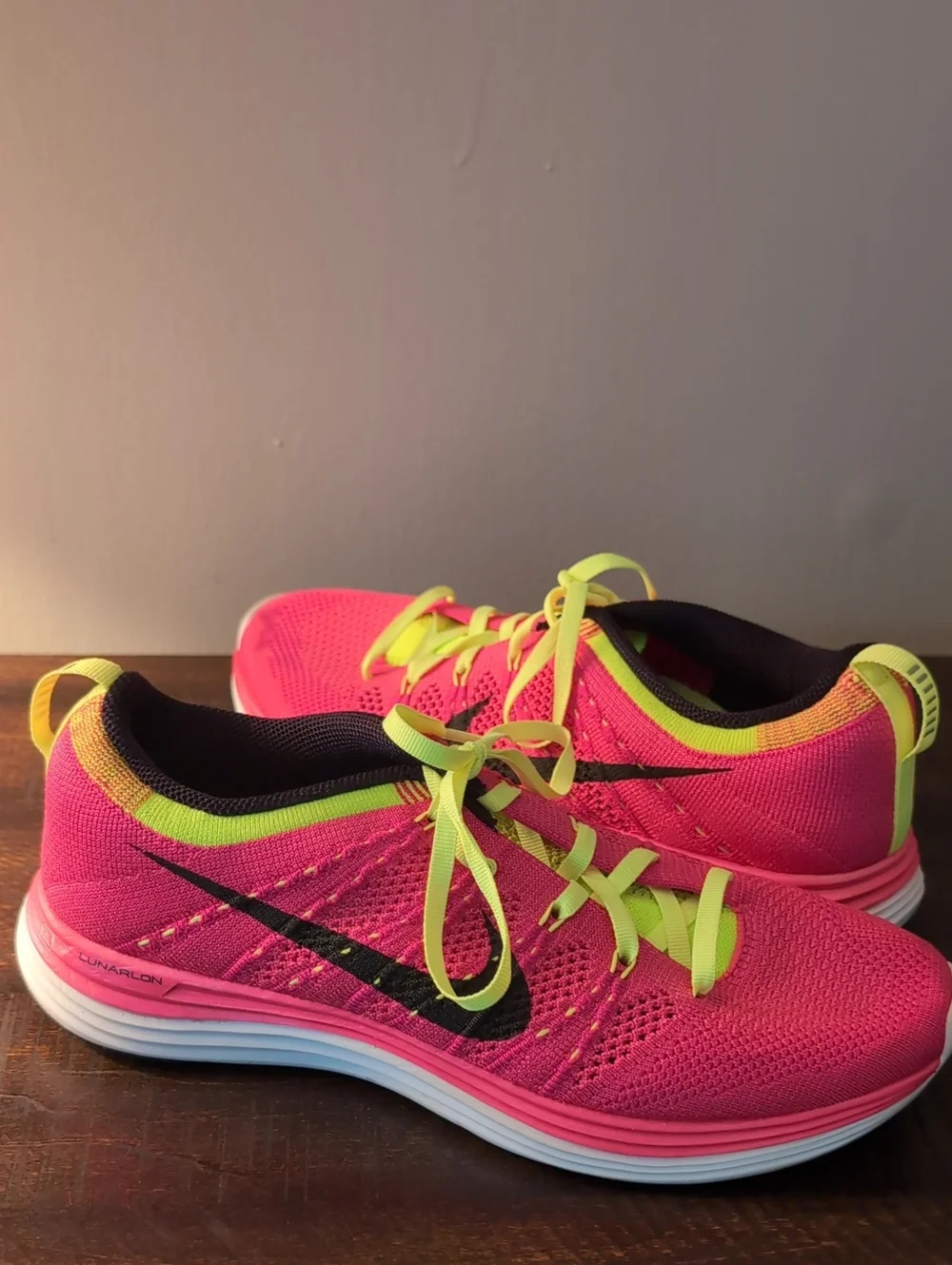 Nike Women’s Pink and Neon Yellow Flyknit Running Shoes